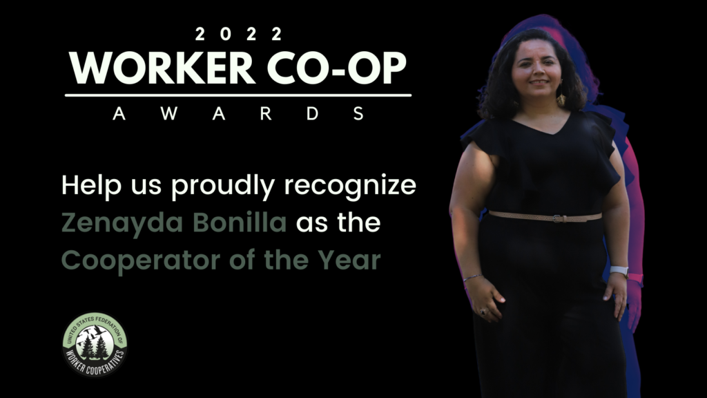 A photo of Zenayda Bonilla who wears a black jumpsuit with ruffled short sleeves with a tan belt and gold earrings and stands smiling in front of the camera with an edited purple shadow effect. Text that reads 2022 Worker Co-op Awards, United States Federation of Worker Cooperatives - Help us proudly recognize Zenayda Bonilla as the Cooperator of the Year. 