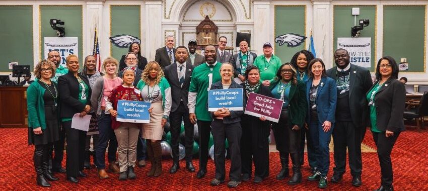 Philadelphia City Council members, worker-owners and advocates pose after city passes resolution declaring 2025 the Year of Cooperatives