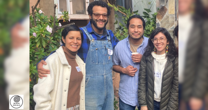 Four brown and black people of different genders smile at the camera
