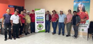 a group of over ten people stand together with a banner that says the agrarian platform inside and smile
