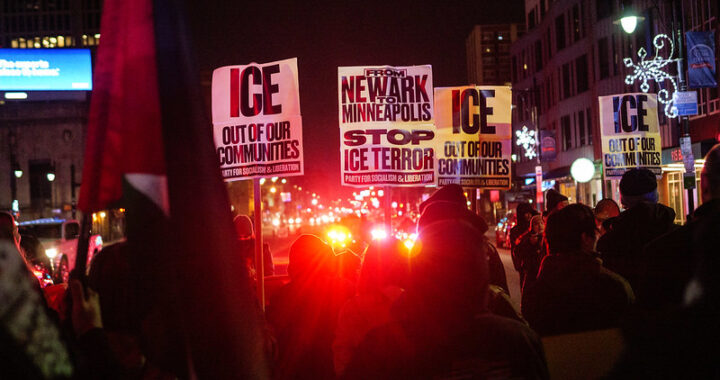 Protest posters that read from Newark to Minneapolis stop ICE terror and red police lights flashing