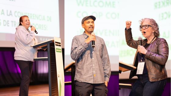 three people speaking through microphones on a stage and gesturing 
